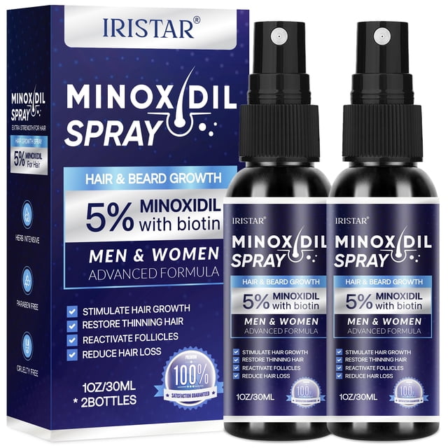 minoxidil spray iristar 5% para la regeneración del cabello para hombres y mujeres Vista frontal de la caja y dos frascos con atomizador negro; etiquetas azules muestran 5% minoxidil con biotina, "hair & beard growth" y 1 oz/30 ml; producto centrado sobre fondo blanco. Apto también como spray de mantenimiento para áreas de barba o entradas finas.