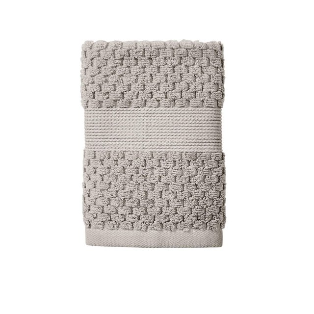 Light gray Better Homes & Gardens Signature Soft Popcorn Texture Towel featuring raised popcorn pattern and smooth central band.