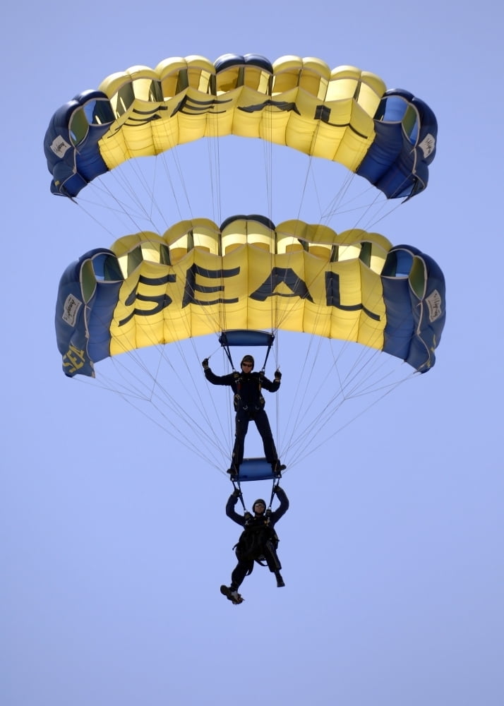 Members of the U.S. Navy Parachute Team the Leap Frogs flare their Members of the U.S. Navy Parachute Team the Leap Frogs flare their