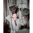 thumbnail image 1 of Mickey Rooney backstage holding pair of feather brooms 1940's 8x10 inch photo, 1 of 1