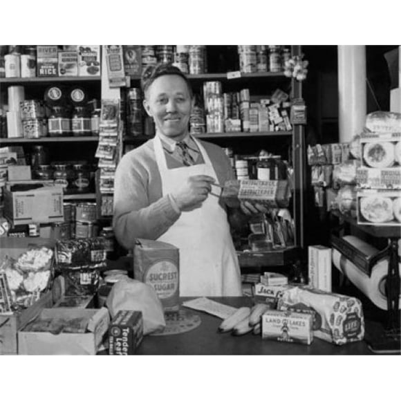 Posterazzi SAL2557132B Grocer Standing in a Store Poster Print - 18 x 24 in.