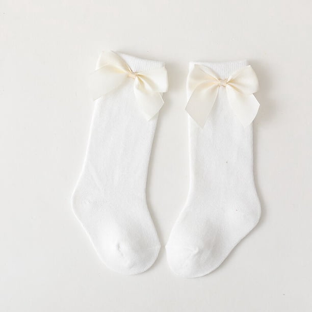 Nueva marca de calcetines para bebés pequeños Otoño Invierno niños niñas hasta la rodilla calcetín largo de algodón lazo grande estilo español calcetines de suelo para niños Tan Jianjun unisex