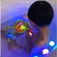 thumbnail image 4 of Juguetes de baño con luz para bebés | Juguetes flotantes de animales marinos con sonido chirriante y red de pesca | Juguetes de piscina con luz LED activada por agua para niños de 1 a 3 años, 4 of 5