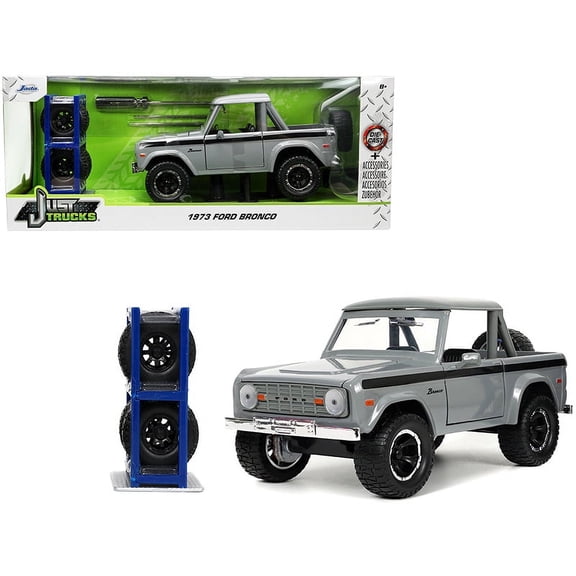 1973 Ford Bronco Pickup Truck Gray with Black Stripes with Extra Wheels "Just Trucks" Series 1/24 Diecast Model Car by Jada