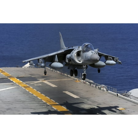 East China Sea March 5 2012 - An AV-8B Harrier jet lands on the flight deck of the forward-deployed amphibious assault ship USS Essex Poster (Best Chinese In Essex)