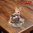 thumbnail image 6 of Rotating acrylic display showcasing a realistic bunny in a flowery Easter basket holding a camera on a cobblestone platform with intricate details, 6 of 8