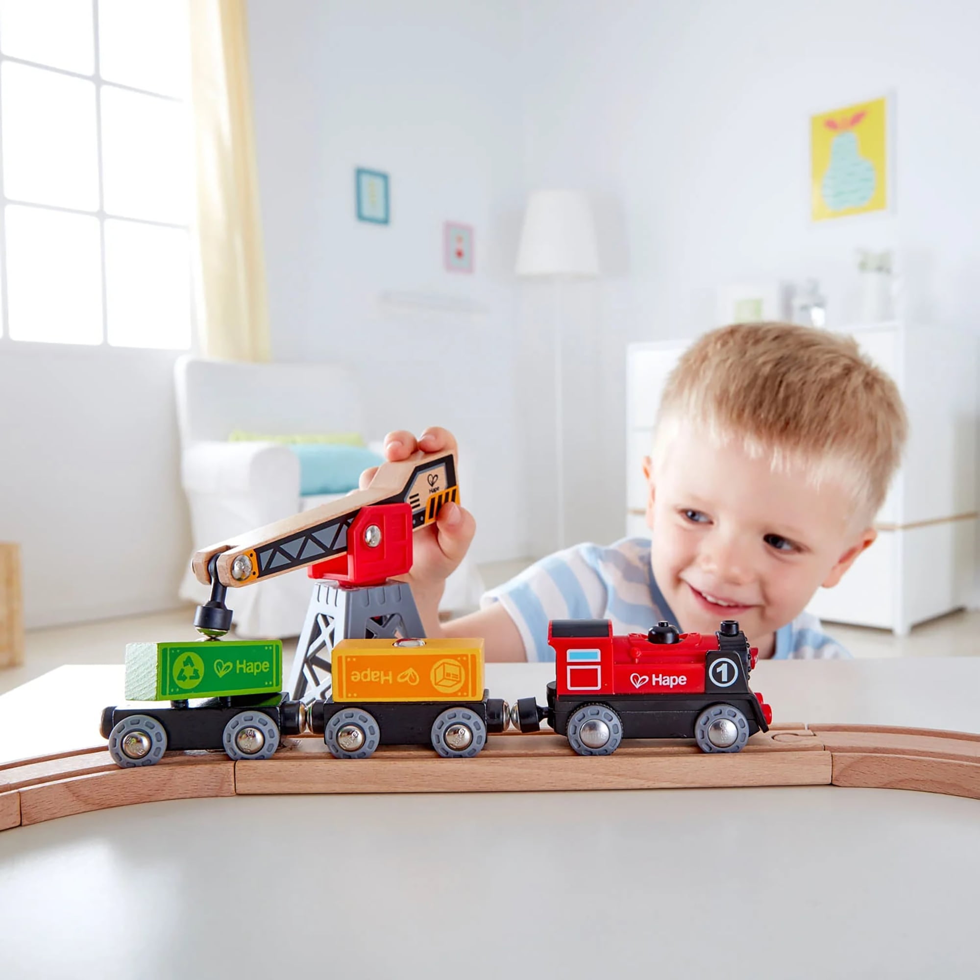Hape: Cargo Delivery Loop - Battery Powered Engine, Oval Track Railway Set, Wooden Toy, 3 Magnetic Linking Trains, Crane, Accessories, Kids Ages 3+