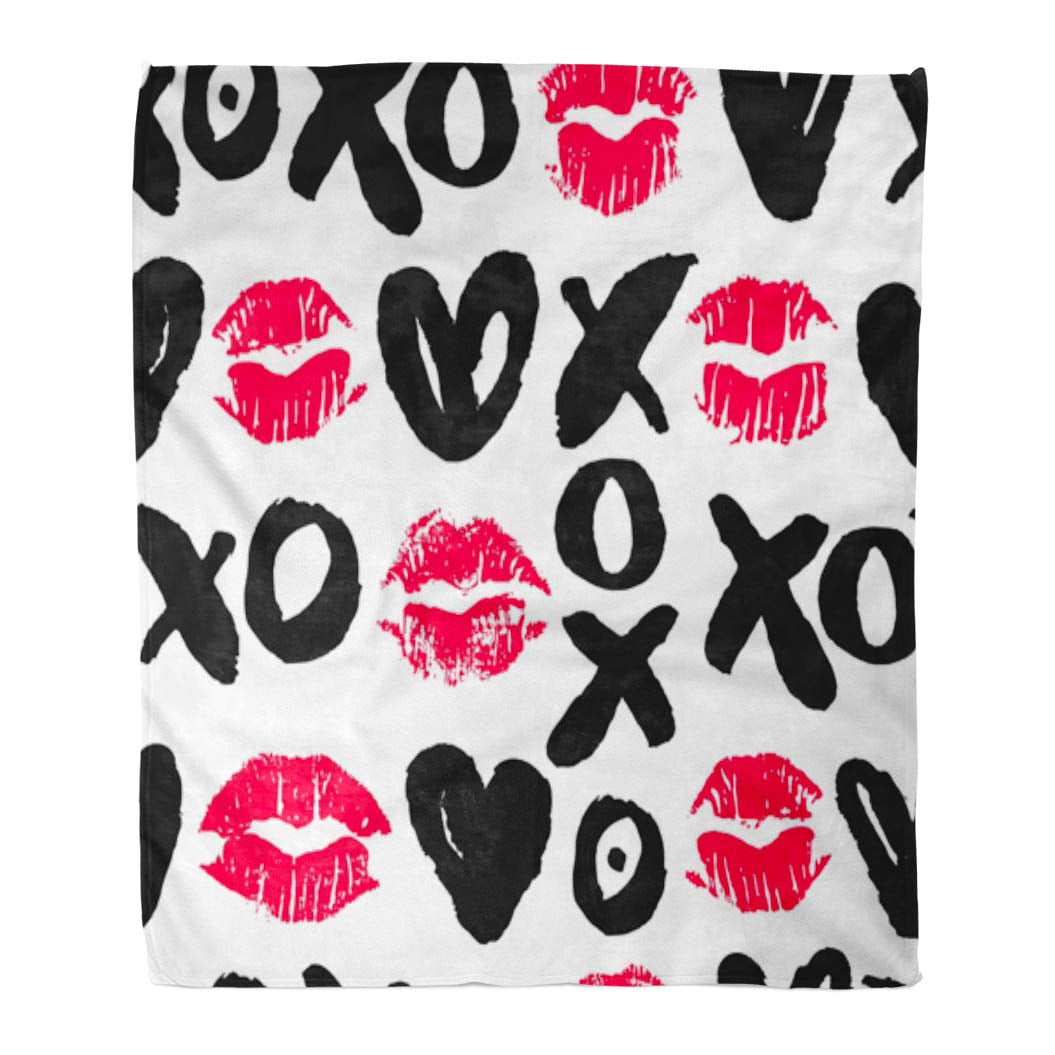 a blanket with a print of x and o's and lip prints for valentines and galentines day