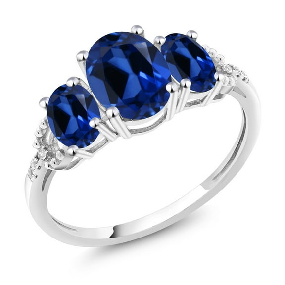 Gem Stone King 10K White Gold Oval Blue Created Sapphire and Diamond Accent 3-Stone Engagement Ring for Women | 2.65 Cttw | Gemstone Birthstone | Wedding Engagement Anniversary Promise Ring| Size 6