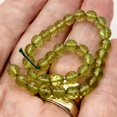 thumbnail image 2 of Amber Faceted Round Beads | 6mm | Green | 34 Bead(s), 2 of 12
