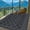 Black Gray, variant on Nanan 10x14 Outdoor Rug,Lightweight Reversible Outdoor Rug, Trellis Pattern with Decorative Diamond Border, Weather Resistant Easy Clean for Yard, Garden, Balcony, Poolside, Picnic, Dark Blue White