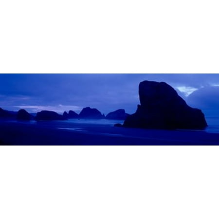 Silhouette of rock formations in the sea Myers Creek Beach Oregon USA Stretched Canvas - Panoramic Images (18 x
