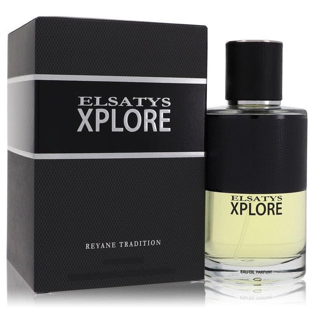 elsatys xplore eau de parfum spray by reyane tradition botella y caja frontal, frasco cilíndrico de vidrio con líquido amarillo pálido, etiqueta negra con texto "ELSATYS XPLORE", tapa negra texturizada y caja negra con bandas plateadas y nombre Reyane Tradition; perfume para mujer.