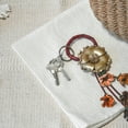 thumbnail image 5 of Gorgeous Marigold Blossom Brown and Gold Floral Leather Bag Ornament Keychain, 5 of 5