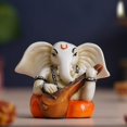 thumbnail image 1 of Polyresin Handcrafted Lord Ganesha Idol Playing Veena Musical Instrument, White & Orange, 1 of 5