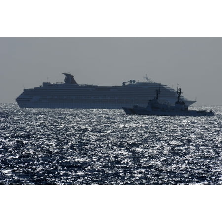 - LAMINATED POSTER U.S. Coast Guard cutter 722 patrols the waters around the Carnival cruise ship C/V Splendor as the a Poster Print 24 x 36