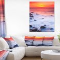 thumbnail image 1 of Coucher de soleil rouge vif sur la côte rocheuse, 1 of 3