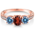 thumbnail image 3 of Gem Stone King 18K Rose Gold Plated Silver 3-Stone Ring Oval Red Garnet and Vivid Persian Blue Moissanite (1.99 Cttw, Size 9), 3 of 6
