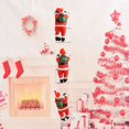 thumbnail image 3 of Santa Claus Takes Part In Christmas Tree Party Decorations By Climbing A Rope Ladder, 3 of 5