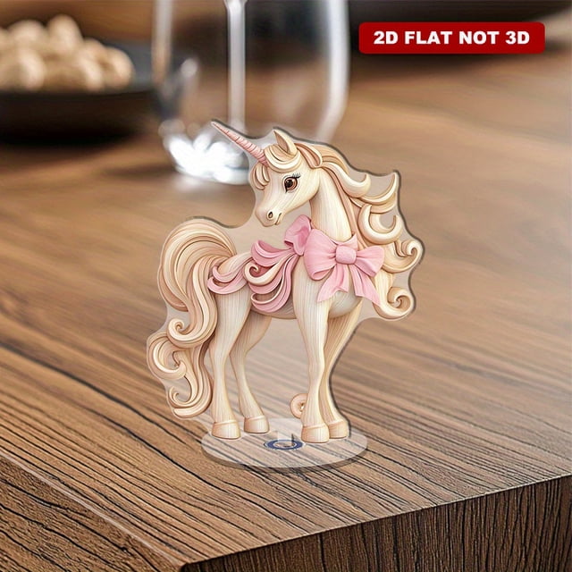 A rotating acrylic display showcasing a beautifully detailed unicorn with flowing pink bows and a realistic wood grain finish