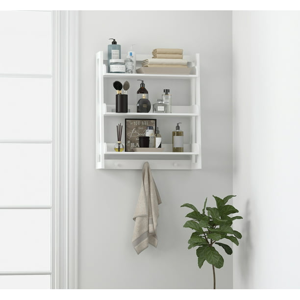 white shelf with hooks below