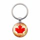 thumbnail image 1 of Llavero con hoja de arce canadiense, colgante de cristal y mosquetón metálico; resistente, ideal para decorar llaves y maletas; regalo patriótico para familiares y amigos, 1 of 4