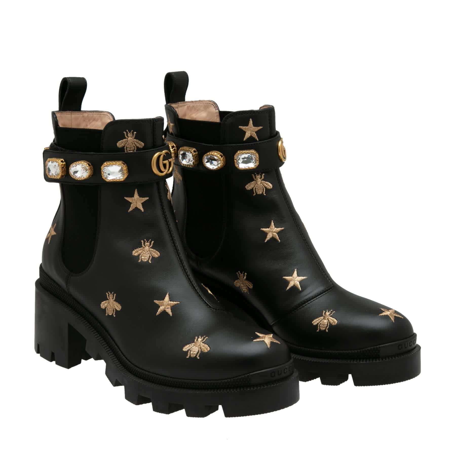 embroidered leather ankle boot with belt gucci