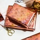 thumbnail image 5 of Rollo de papel de regalo Merture metalizado en oro rosa holográfico, 5 of 7
