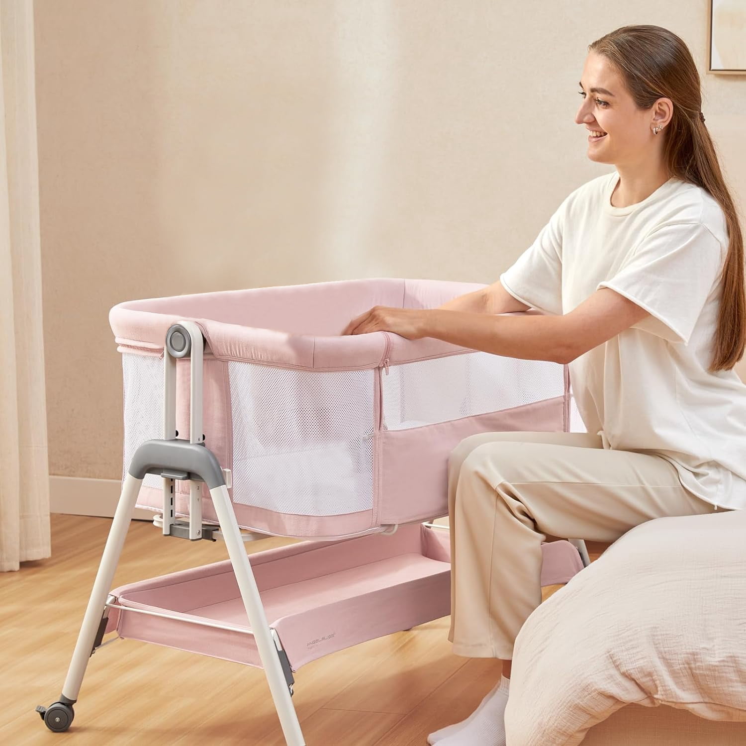 ANGELBLISS Flat Bedside Bassinet with Storage Basket, Easy Folding Portable Crib with Wheels, Included Breathable Mesh, Cozy Mattress(Pale Pink)(0-6 months)