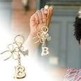thumbnail image 4 of Bubble Initial Keychain with Bow & Butterfly - Gold Letter Bag Charms for Women, Cute Purse Handbag Accessories, 4 of 8