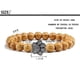 thumbnail image 2 of Pulsera con dije de huella de pata de piedra volcánica de lava negra mate natural, ideal como recuerdo para mascotas, amantes de los gatos y los perros., 2 of 2