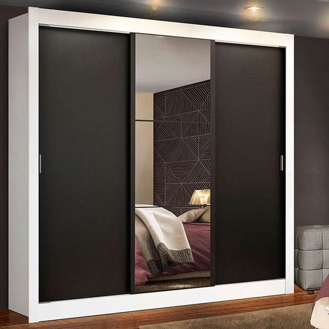 ropero closet madesa mônaco 3 puertas corredizas 1 y espejo en blanco y negro, vista frontal de tres puertas corredizas con marco blanco y paneles negros; puerta central con espejo vertical que refleja una cama y pared decorativa; tiradores de PVC, rieles de aluminio visibles y base sobre piso de madera; interior indicado con tres estantes, seis nichos y perchero metálico resistente, medidas 205 cm alto x 170 cm ancho x 46 cm fondo; también adecuado para organizar ropa de temporada en habitaciones principales.