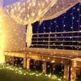 thumbnail image 1 of Cortina de luz led, red de luz 6x3m 600 Leds, IP44 impermeable de bajo voltaje 31v, 8 modos de luces de hadas de cortina para interior, Navidad, habitación infantil, exterior, fiesta, boda, etc. Xemadio ZH-419, 1 of 6