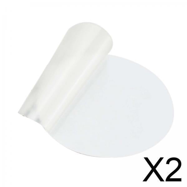 parche de reparación de carpa kits de reparación de parches de tpu redondos transparentes — dos parches autoadhesivos redondos de 7 cm x 7 cm, vista frontal sobre fondo blanco; uno parcialmente despegado para mostrar la película protectora translúcida y la cara adhesiva, diseño transparente para reparaciones discretas en colchones de aire, flotadores y juguetes inflables, compatible con PVC, nailon y lona; se recomienda activar con agua caliente y dejar curar 24 horas.