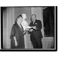 thumbnail image 2 of Historic Framed Print, Rep. Bloom presents sculptress with check from anonymous New Yorker to save home. Washington, D.C., Nov. 18. Early this week a reporter on a local paper disc, 17-7/8" x 21-7/8", 2 of 9