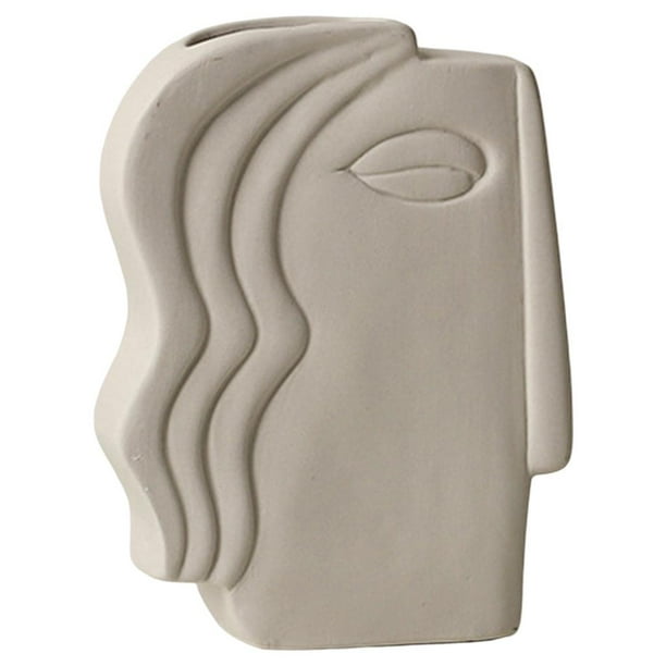 Jarrón de cerámica con flores secas, diseño creativo y sencillo para decoración del hogar. Cara de doble cara