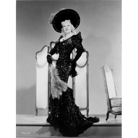 Mae West Posed in Black Glossy Dress with Black Hat Photo Print