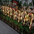 thumbnail image 2 of Muleta solar tricolor de Papá Noel con forma de estrella, copo de nieve, mango de paraguas, caramelo, luz LED para césped para exteriores, 2 of 6