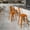 Orange, variant on Emma + Oliver Commercial Grade 24"H Distressed Orange Metal Indoor-Outdoor Counter Stool