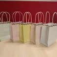 thumbnail image 1 of KAKOWELY 10 bolsas de regalo para fiestas: mini bolsas de papel con asa de colores para bodas, baby showers, Día de la Madre y celebraciones., 1 of 4