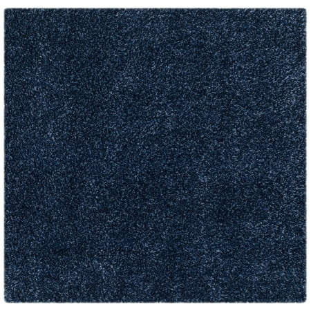 Safavieh SAFAVIEH California Shag Collection SG151-7070 Navy Rug SAFAVIEH California Shag Collection SG151-7070 Navy Rug SAFAVIEH s California Shag Collection imparts breezy coastal vibes throughout room decor. These plush pile shags are made using high-quality synthetic yarns  machine-woven into luxurious shag textures and colored in vivid hues with stylishly speckled tonal colors. These superior non-shedding shag rugs add flowing dimension to any decor  and are also well-suited for higher-traffic areas of the home with frequent kid or pet activity. Perfect for the living room  dining room  bedroom  study  home office  nursery  kid s room  or dorm room. Rug has an approximate thickness of 2 inches. For over 100 years  SAFAVIEH has set the standard for finely crafted rugs and home furnishings. From coveted fresh and trendy designs to timeless heirloom-quality pieces  expressing your unique personal style has never been easier. Begin your rug  furniture  lighting  outdoor  and home decor search and discover over 100 000 SAFAVIEH products today.