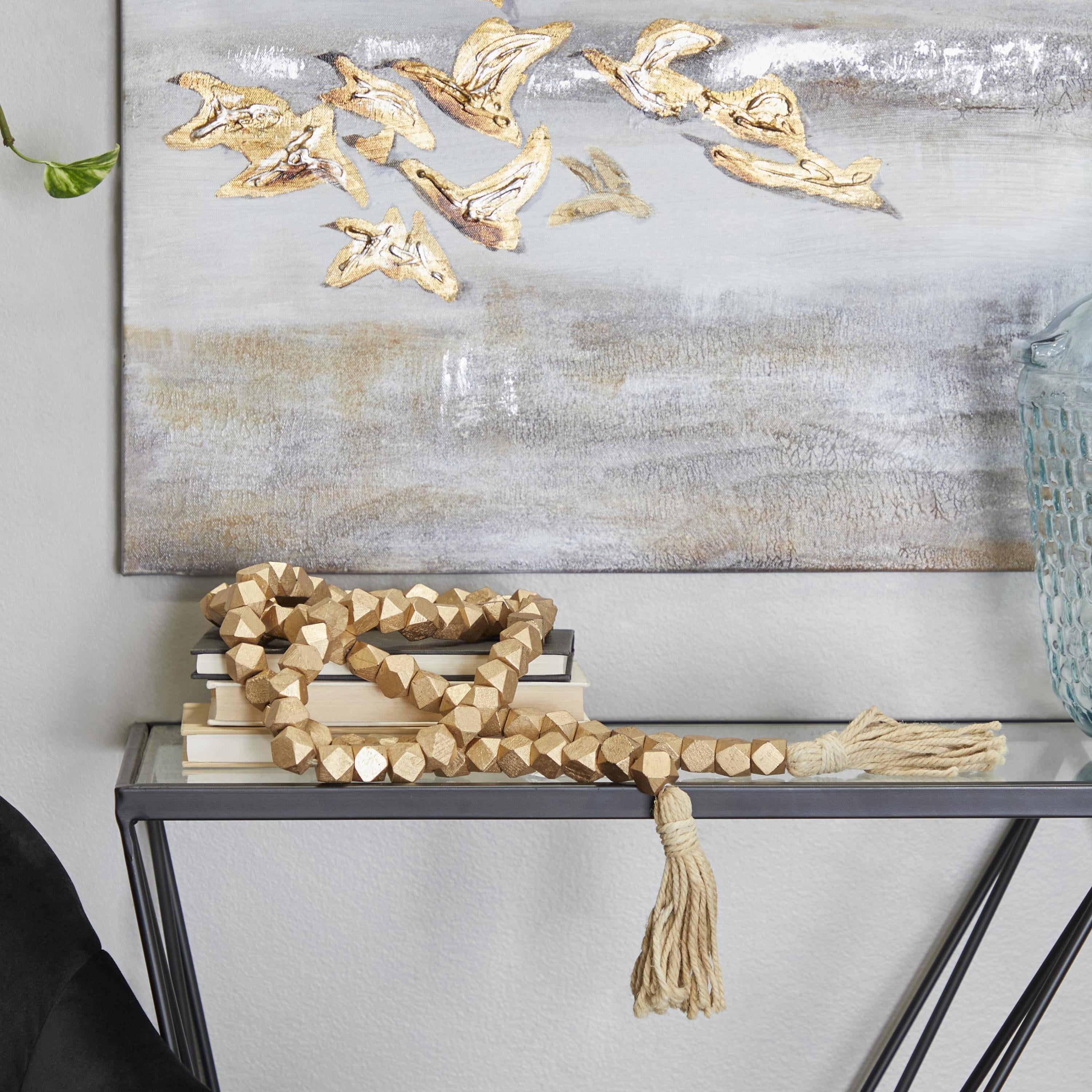 DecMode Handmade Hexagon Metallic Carved Geometric Long Gold Mango Wood Garland with Tassel
