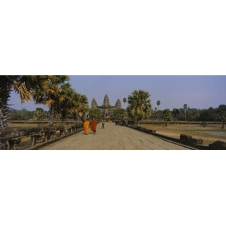 Two monks walking in front of an old temple Angkor Wat Siem Reap Cambodia Canvas Art - Panoramic Images (18 x (Best Time To Visit Angkor Wat Temple)