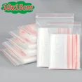 thumbnail image 1 of 100/300 Uds. Bolsas selladas con cremallera gruesa bolsa de almacenamiento de plástico transparente para joyería pequeña embalaje de alimentos bolsa d, 1 of 5