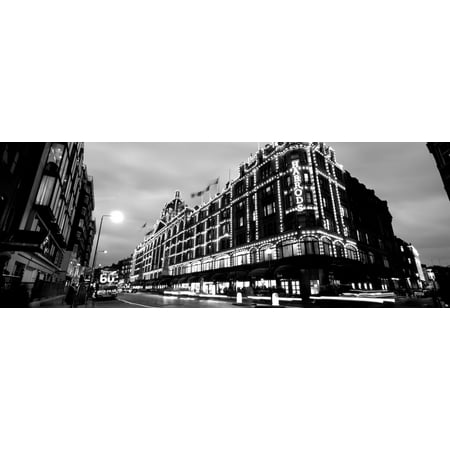 Low angle view of buildings lit up at night Harrods London England Canvas Art - Panoramic Images (7 x 18)