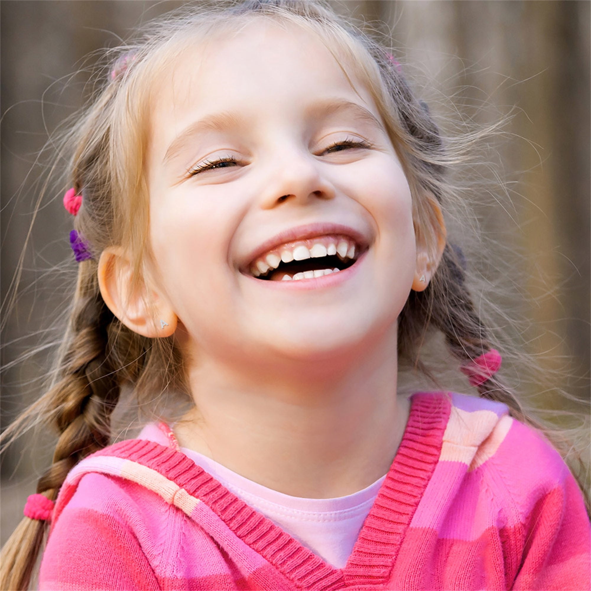 Маленькая девочка улыбается. The most beautiful smile in the world. Девочка с волосами. Девочка. Маленькая девочка улыбается.