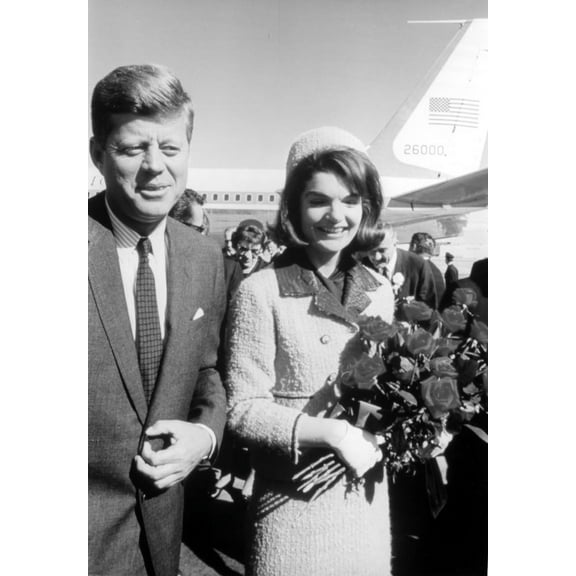 President John F Kennedy and Jackie Onassis holding flowers Photo Print (8 x 10)