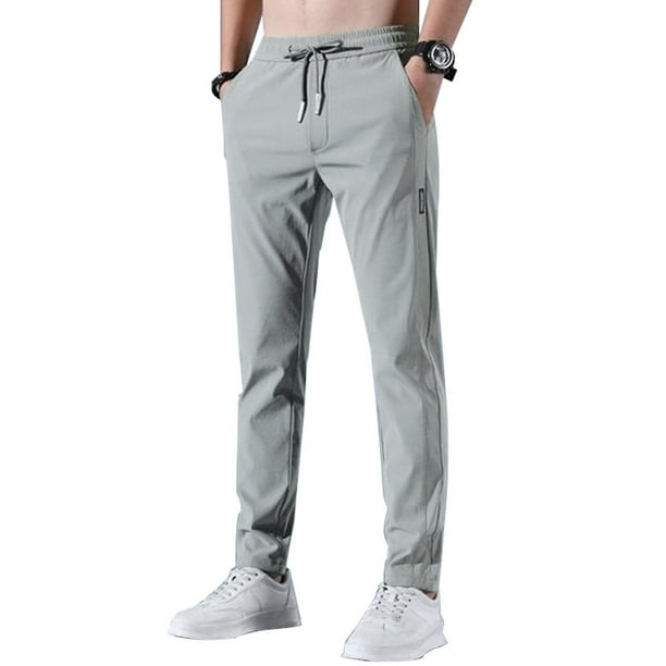 Pantalones elásticos de secado rápido para hombre de color sólido con absorción de humedad y cintura expandible