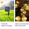thumbnail image 4 of Guirnaldas de luces solares, 50 luces LED decorativas con bolas de cristal para exteriores de 23 pies para jardín, patio, Navidad, 4 of 5