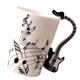 thumbnail image 1 of Inteprter Taza de cerámica elegante y duradera Tazas de té Regalo para los amantes del té Taza de notas musicales elegante y novedosa Guitarra Type3 NO3, 1 of 1